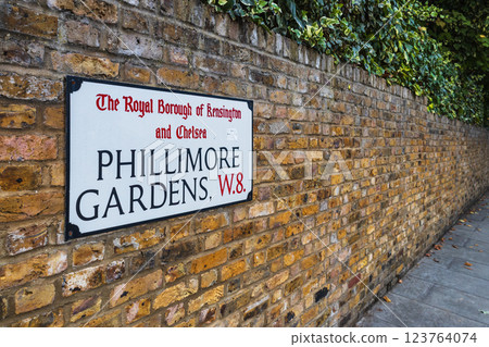 Phillimore Gardens Street Sign on a Brick Wall in a Charming London Neighborhood 123764074