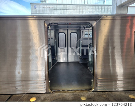 open doors of steel subway car at empty station, subway train stop at platform, no people, entering empty train car in metro 123764218