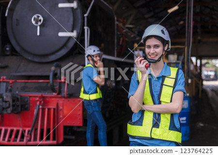 Engineer checking construction process railway and checking work on railroad station . Engineer checking construction process railway and checking work on railroad station . 123764225