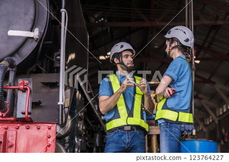 Engineer checking construction process railway and checking work on railroad station .  Engineer checking construction process railway and checking work on railroad station .  123764227