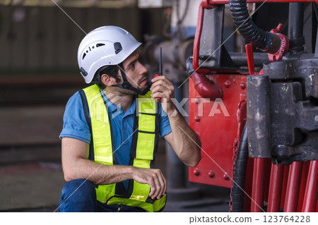 Engineer checking construction process railway and checking work on railroad station .  123764228