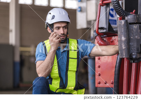 Engineer checking construction process railway and checking work on railroad station .  123764229