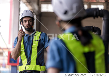 Engineer checking construction process railway and checking work on railroad station .  123764232