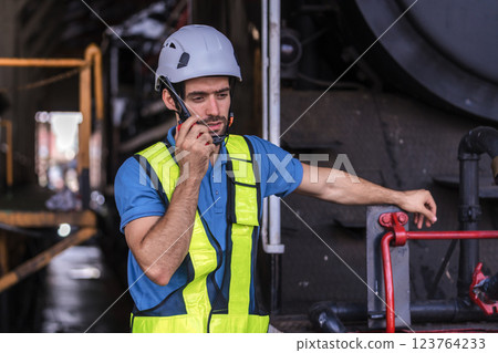Engineer checking construction process railway and checking work on railroad station .  123764233