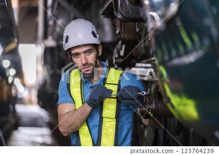 Engineer checking construction process railway and checking work on railroad station . Engineer checking construction process railway and checking work on railroad station . 123764239