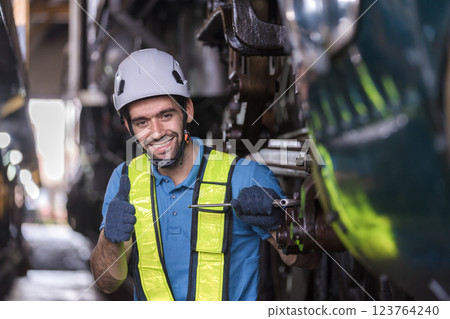 Engineer checking construction process railway and checking work on railroad station . Engineer checking construction process railway and checking work on railroad station . 123764240