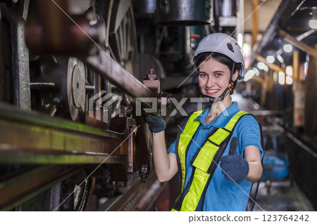 Engineer checking construction process railway and checking work on railroad station . Engineer checking construction process railway and checking work on railroad station . 123764242