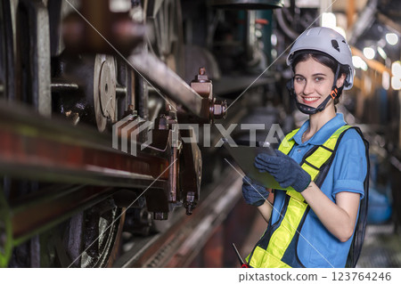 Engineer checking construction process railway and checking work on railroad station .  123764246