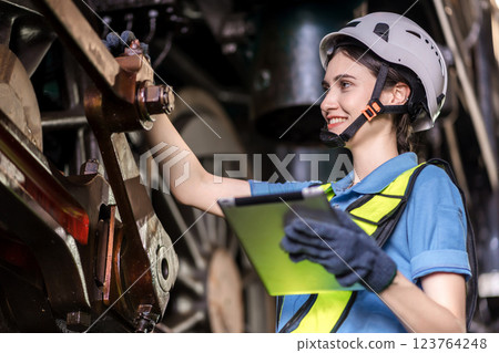 Engineer checking construction process railway and checking work on railroad station . Engineer checking construction process railway and checking work on railroad station . 123764248