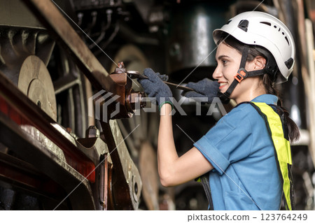 Engineer checking construction process railway and checking work on railroad station . Engineer checking construction process railway and checking work on railroad station . 123764249