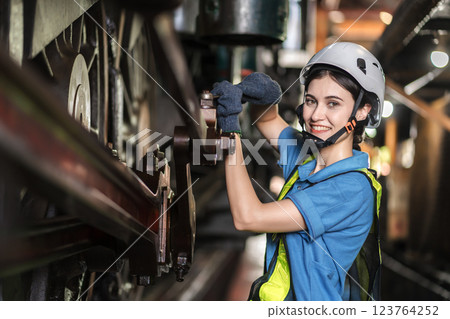 Engineer checking construction process railway and checking work on railroad station .  123764252