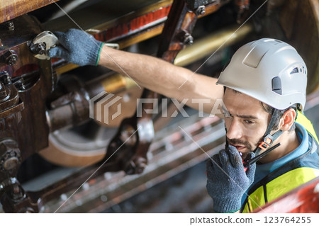 Engineer checking construction process railway and checking work on railroad station .  123764255