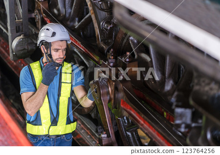 Engineer checking construction process railway and checking work on railroad station . Engineer checking construction process railway and checking work on railroad station . 123764256