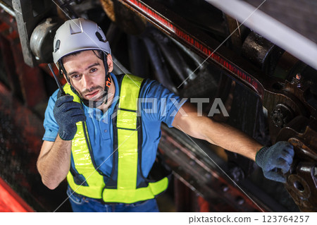 Engineer checking construction process railway and checking work on railroad station .  123764257