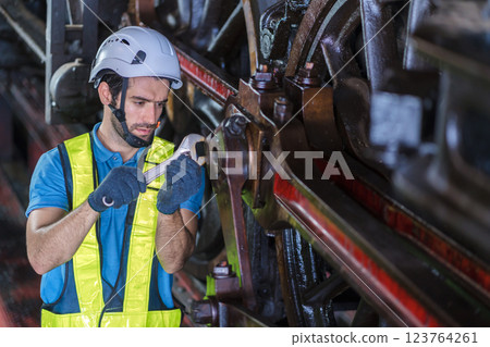 Engineer checking construction process railway and checking work on railroad station . Engineer checking construction process railway and checking work on railroad station . 123764261