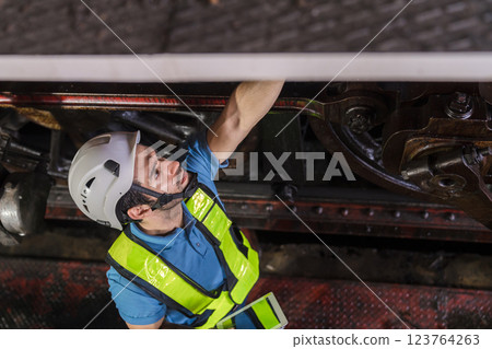 Engineer checking construction process railway and checking work on railroad station . Engineer checking construction process railway and checking work on railroad station . 123764263