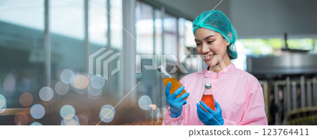 Worker Checking quality or checking stock of glass bottle in beverage factory 123764411