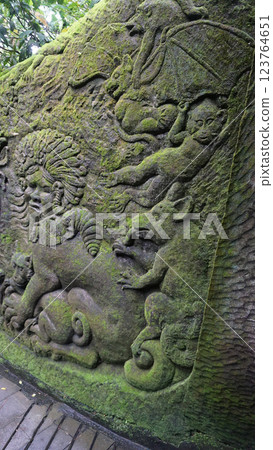 Fragment of bas-relief featuring monkeys on Padangtegal Great Temple of Death or Pura Dalem Agung Padangtegal in the Sacred Monkey Forest of Padangtegal, Ubud, Bali, Indonesia Fragment of bas-relief featuring monkeys on Padangtegal Great Temple of Death or Pura Dalem Agung Padangtegal in the Sacred Monkey Forest of Padangtegal, Ubud, Bali, Indonesia 123764651