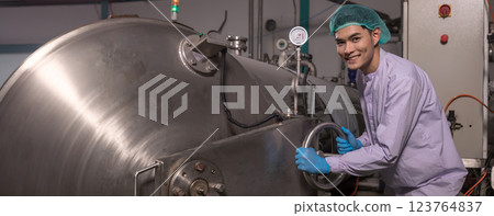 Worker Checking quality or checking stock of glass bottle in beverage factory.  123764837