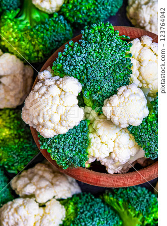 Pieces of ripe broccoli and cauliflower. Green planet concept Pieces of ripe broccoli and cauliflower. Green planet concept 123764942