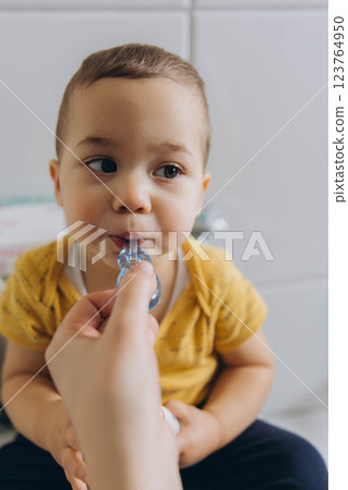 Dental care, mother brushing teeth with boy for wellness,Bathroom, oral health toothbrush 123764950