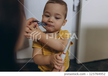 Dental care, mother brushing teeth with boy for wellness,Bathroom, oral health toothbrush 123764952