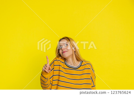 Inspired young woman having good idea, plan, startup, showing inspiration motivation Eureka gesture Inspired young woman having good idea, plan, startup, showing inspiration motivation Eureka gesture 123765624