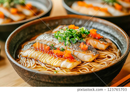 Fish noodle soup served in a beautifully designed bowl, showcasing the local culinary heritage Fish noodle soup served in a beautifully designed bowl, showcasing the local culinary heritage 123765703