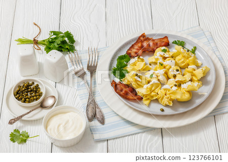sacchettoni, pasta with bacon and cheese filling sacchettoni, pasta with bacon and cheese filling 123766101