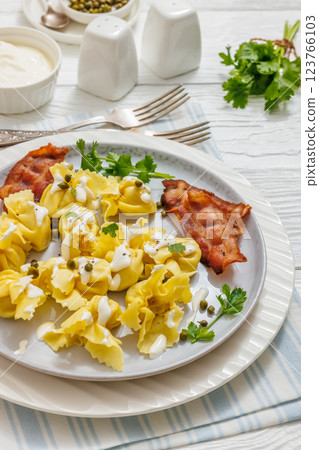 sacchettoni, pasta with bacon and cheese filling 123766103