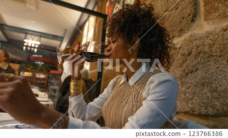 Woman with glass of wine 123766386