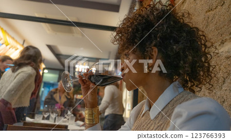 Woman with glass of wine 123766393