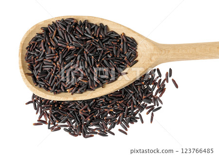 Black wild rice in wooden spoon isolated on white background close up. Top view. Flat lay Black wild rice in wooden spoon isolated on white background close up. Top view. Flat lay 123766485