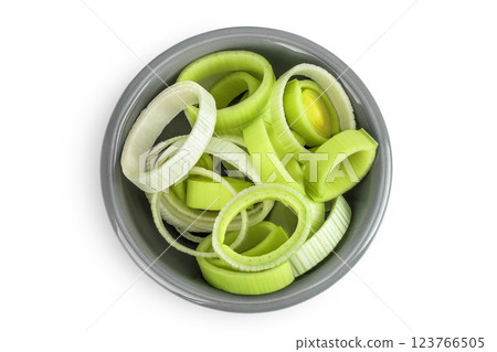 sliced Leek vegetable in ceramic bowl isolated on white background. Top view. Flat lay sliced Leek vegetable in ceramic bowl isolated on white background. Top view. Flat lay 123766505