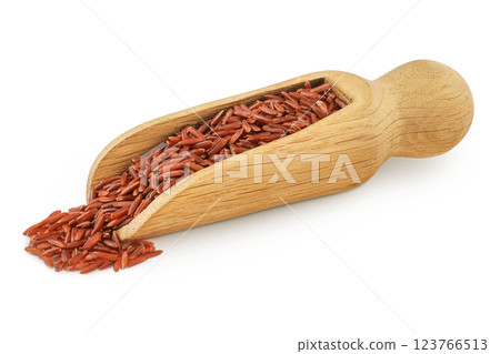 red rice in a wooden scoop isolated on white background 123766513