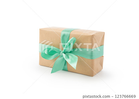 Brown paper gift box with green ribbon isolated on white Brown paper gift box with green ribbon isolated on white 123766669