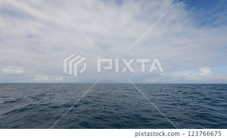 Side view from boat in Indian ocean sailing between Seychelles islands in daytime Side view from boat in Indian ocean sailing between Seychelles islands in daytime 123766675
