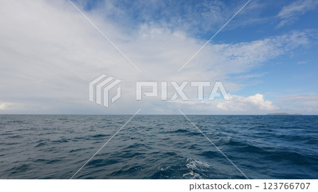 Side view from boat in Indian ocean sailing between Seychelles islands in daytime Side view from boat in Indian ocean sailing between Seychelles islands in daytime 123766707