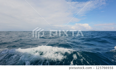 Side view from boat in Indian ocean sailing between Seychelles islands in daytime 123766938