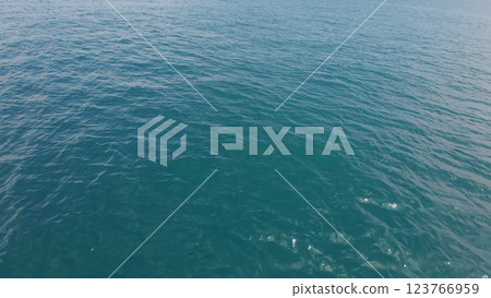 Turquoise Blue Indian ocean waves closeup from boat 123766959