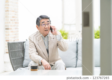 Senior man talking on a smartphone 123767265