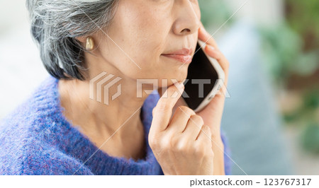 Senior woman talking on smartphone Senior woman talking on smartphone 123767317