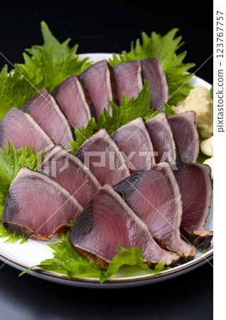 Fresh seared bonito on a black background Fresh seared bonito on a black background 123767757