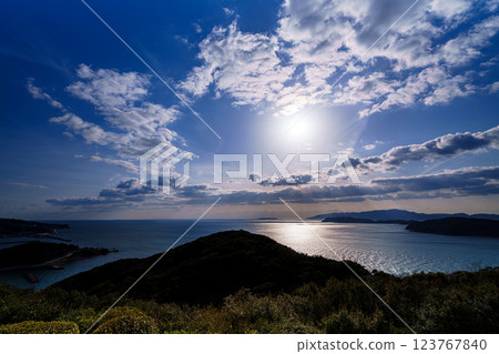 Early spring in the Kitan Straits. Ships passing by, clouds drifting by, and a beautiful sunset. Before sunset. 123767840