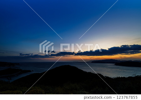 Early spring in the Kitan Straits. Ships passing by, clouds flowing, and a beautiful sunset. After sunset, the sky is glowing. Early spring in the Kitan Straits. Ships passing by, clouds flowing, and a beautiful sunset. After sunset, the sky is glowing. 123767855