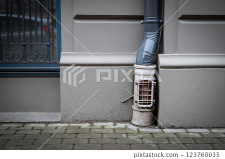 Corner of Building with Gutter and Protective Covering Corner of Building with Gutter and Protective Covering 123768035