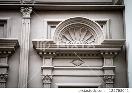 Architectural Detail of Ornate Carved Stone Wall with Decorative Trim 123768041
