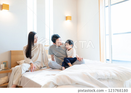 Young family having a conversation in the bedroom 123768180
