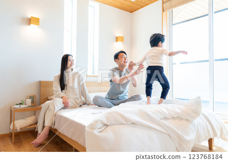 Young family having a conversation in the bedroom 123768184