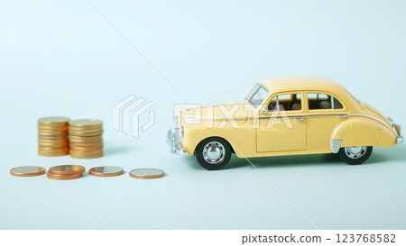 Car loan - Money placed next to a miniature car 123768582